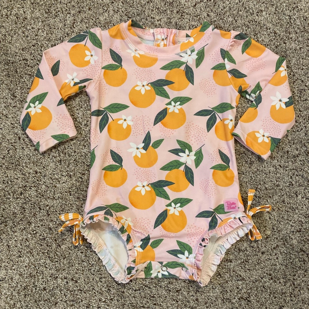 Ruffle Butts “Orange You the Sweetest” Long Sleeve One Piece Rash Guard Swimsuit